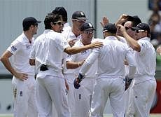 England players celebrate the wicket of Australia's Phillip Hughes who was run out during the third day of their fourth Ashes cricket test match at the Melbourne Cricket Ground in Melbourne, Australia, Tuesday, Dec. 28, 2010. (AP Photo/Andrew Brownbill)