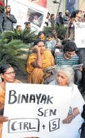 Members of various organisations stage a protest against the conviction of human rights activist Dr Binayak Sen in front of the Town Hall on Wednesday. DH Photo