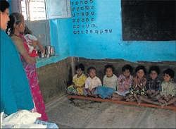 Children wait for the  afternoon meals at an Anganwadi Centre. DH  Photo