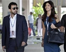 Bollywood actress and co-owner Rajasthan Royals team Shilpa Shetty, right, arrives with her husband Raj Kundra for the Indian Premier League (IPL) player auction in Bangalore, India, Saturday, Jan. 8, 2011.  AP