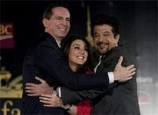 Ontario Premier Dalton McGuinty, left, embraces Bollywood film stars Preity Zinta and Anil Kapoor, right, in Toronto, on Wednesday, Jan. 19, 2011, during the announcement that the International Indian Film Academy Awards ceremony will be held in Toronto on June 23-25, 2011. AP Photo
