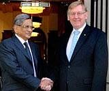 External Affairs Minister S M Krishna shakes hands with Australia's Resource, Energy and Tourism Minister Martin Ferguson during a high-level meeting in Melbourne on Wednesday. PTI Photo