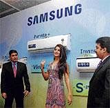 Bollywood actress Jacqueline Fernendez (right) and Samsung India Deputy Managing Director Ravinder Zutshi at the launch of the company's new ACs in Hyderabad on Thursday. PTI