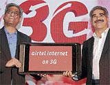 Bharti Airtel President Atul Mohan Bindal (left) and Operations Director for Mobile Services Vineet Taneja at 3G service launch event in Bangalore on Monday. DH Photo