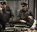 A man wounded in a blast is evacuated from Domodedovo airport in Moscow, on Monday. AP
