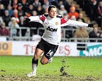 Timely Strike: Manchester United's Javier Hernandez  celebrates after scoring the team's second goal against Blackpool at Bloomfield Road on Tuesday. Reuters