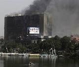 The ruling National Democratic party building burns in Cairo, on Saturday. Reuters