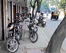 Common: Two-wheelers parked on a footpath in Sheshadripuram dh photos by Manjunath M S