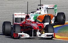 Ferrari Formula One driver Fernando Alonso of Spain drives ahead of Force India Formula One driver Paul di Resta of Britain during a test session at the Ricardo Tormo race track in Cheste, near Valencia, Spain, on Wednesday. AP