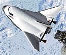 An artists rendering of Sierra Nevada Corporations Dream Chaser spacecraft..  NYT