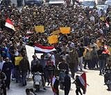 Anti-government protesters march through a street in Cairo, Egypt on Friday.AP