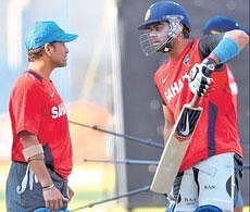 Sachin Tendulkar has a tip or two for Virat Kohli at the nets in Bangalore on Friday. DH Photo