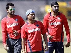 Indian cricketers Virat Kohli, left, Sachin Tendulkar, center, and Harbhajan Singh  .  AP Photo