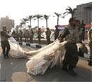 Egyptian Army soldiers remove tents of protesters from Tahrir Square in downtown Cairo, Egypt, Sunday. AP