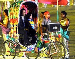 Joy ride: Indias Mahendra Singh Dhoni enters the Bangabandhu National stadium in a rickshaw during the opening ceremony of the 2011 cricket World Cup in Dhaka on Thursday. AFP