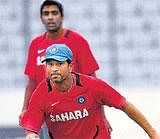 India cricketer Sachin Tendulkar , center, and his teammates during practice session in Dhaka, Bangladesh, Friday. AP