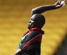 David Obuya of Kenya bowls during a practice session ahead of their ICC Cricket World Cup match against New Zealand, in Chennai, India. AP Photo
