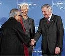 Union Finance Minister Pranab Mukherjee greets his French counterpart Christine Lagarde and Bank of France Governor Christian Noyer at the Bercy ministry before the G20 finance ministers and central bank governors meeting, in Paris, on Saturday. AFP