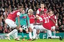 Keeping It Tight Arsenal contained Barcelona spearhead Lionel Messi with an exemplary display of defence.