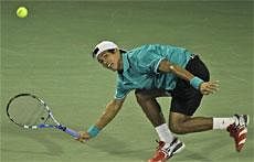 India's Somdev Devvarman returns the ball to Roger Federer of Switzerland during the second day of the Emirates Dubai ATP Tennis Championships in Dubai  AP Photo