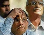 tROUBLED times: Investors watch with anxiety writ large at the falling share prices on the digital board display at the Bombay Stock Exchange in Mumbai on Thursday. AFP