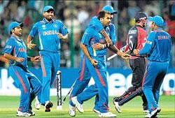 Indian players celebrate the wicket of Englands Paul Collingwood whose dismissal by Zaheer Khan dramatically turned around a vital World Cup match at the Chinnaswamy Stadium in Bangalore on Sunday. AFP.