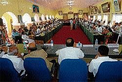 Representatives from various organisations and elected representatives taking part in a peace meeting held in Madikeri on Sunday.