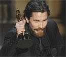 Christian Bale accepts the Oscar for best performance by an actor in a supporting role for ''The Fighter'' at the 83rd Academy Awards on Sunday. AP