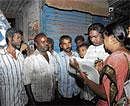 Not Left Out: Shantkumari and her team of enumerators gather information from the homeless at Kalasipalya on Monday night. DH Photo