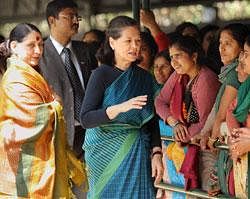 Congress President Sonia Gandhi meets 'Mahila Congress' activists on the occasion of International Women's Day in New Delhi on Tuesday.Women and Child Development Minister Krishna Tirath is seen at left. PTI Photo