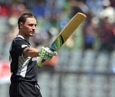 New Zealand's batsman Brendon McCullum celebrates his century during the Cricket World Cup 2011 match between Canada and New Zealand at The Wankhede Cricket Stadium in Mumbai on Sunday. AFP