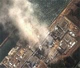 Smoke was seen rising from the No. 3 reactor at Japan's Fukushima Daiichi nuclear plant after a blast in this hand out satellite image taken March 14, 2011. DIGITAL GLOBE REUTERS