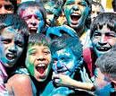 United colours of bangalore: Children play Holi in the City on Sunday. DH Photo
