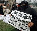 Members of the Jammu and Kashmir Affected Families (JKAF) hold placards during a sit-in protest against human rights violation in Srinagar on Thursday. PTI