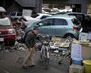 A man cleans his bicycle at an area destroyed by the tsunami in Kamaishi town, Iwate Prefecture in northern Japan -Reuters photo