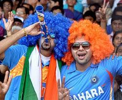 Team India supporters hold jubilate during the team's CWC 2011 quarterfinal match against Australia at Sardar Patel Stadium in Motera, Ahmedabad on Thursday. PTI