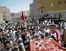 Demonstrators participate in the funeral services of one of the protestors killed during protests last week, in the village of Sitra , Bahrain. NYT
