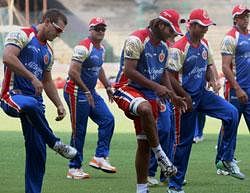 Royal Challengers Bangalore cricketers during a practice session for the IPL tournament. PTI