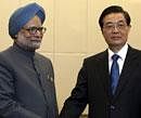 India's Prime Minister Manmohan Singh, left, is greeted by Chinese President Hu Jintao in Sanya, Hainan province, China. AP