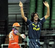 Deccan Chargers' Ishant Sharma celebrates the wicket of Kochi Tuskers Kerala's Brad Hogg during their IPL-4 cricket match in Kochi on Wednesday. PTI