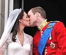 Prince William and his wife Kate, Duchess of Cambridge, kiss on the balcony of Buckingham Palace in London, following their wedding at Westminster Abbey on Friday. AP