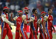 Royal Challengers Bangalore's captain Daniel Vettori, third left, leaves the field with teammates after their win in an Indian Premier League (IPL) cricket match against Pune Warriors in Bangalore, India. AP Photo