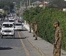 Pakistan army soldiers stand guard near the compound where it is believed al-Qaeda leader Osama bin Laden lived in Abbottabad, Pakistan on Monday. AP