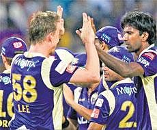 High Fives!: Lakshmipathi Balaji is congratulated by Brett Lee after getting rid of Michael Hussey at Eden Gardens on Saturday night. PTI