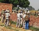 Police in action during a violent clash with farmers from Bhatta Parsaul village in Greater Noida on Saturday. PTI