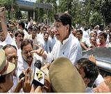 Rashtriya Lok Dal president Ajit Singh being stopped by the police while going to Bhatta-Parsaul village to meet the agitating farmers, in Noida on Sunday.