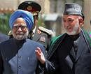 Prime Minister Manmohan Singh with Afghanistan President Hamid Karzai during a ceremonial welcome on his arrival in Kabul on Thursday. PTI Photo