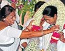 Mass leader:  Mamata Banerjee being garlanded after her election as Trinamool  Congress legislature party leader at Maharastra Niwas in Kolkata on Sunday. PTI