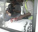 A Pakistani cameraman records video of a Saudi consulate employee who was shot dead in Karachi, Pakistan on Monday. AP Photo