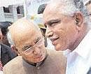 War and Peace: Chief Minister B S Yeddyurappa greets Governor H R Bhardwaj at a function in Bangalore  on Wednesday. DH Photo